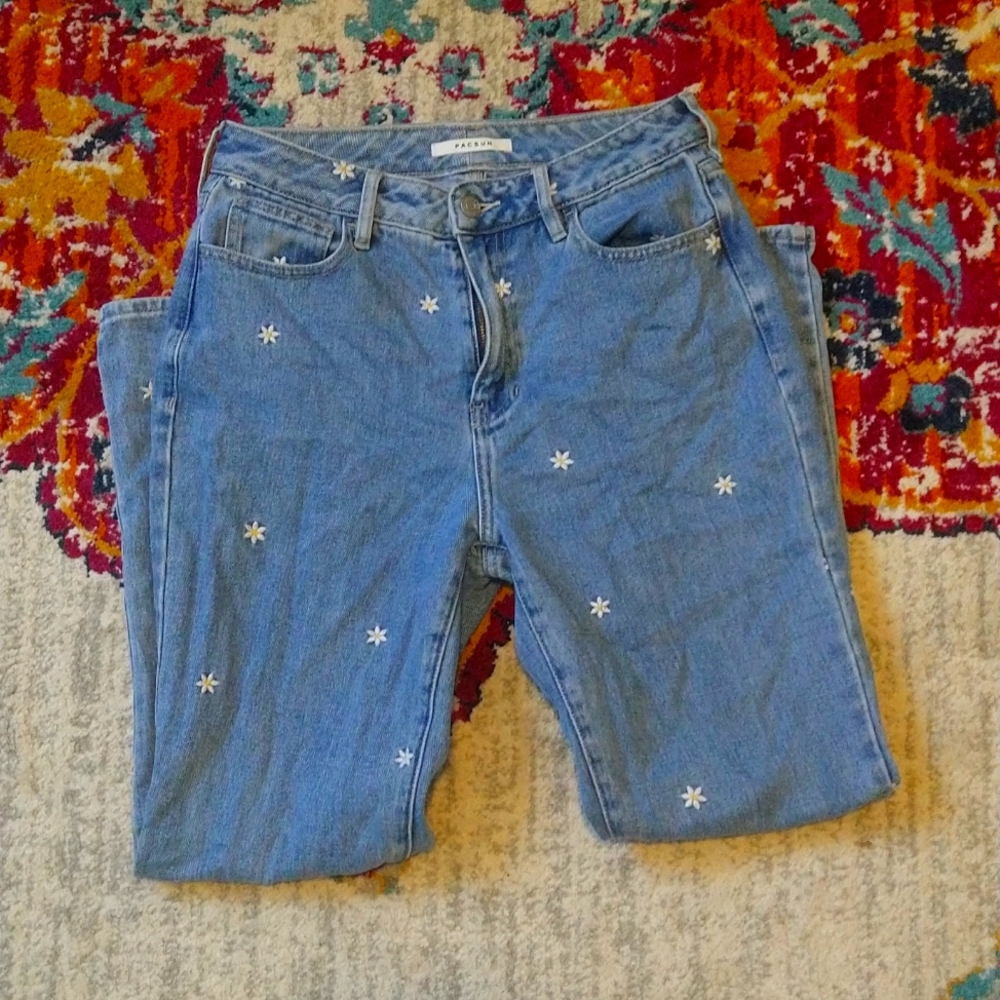 Mom jeans with daisy embroidery.
